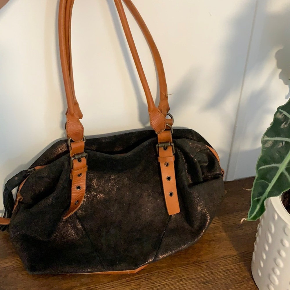 Anthro holding horses satchel!